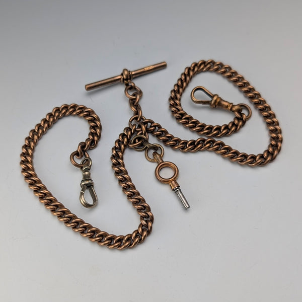 Antique British rolled gold double Albert chain with brass key fob